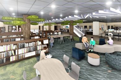 Modern library interior with bookshelves, tree-like structures, seating areas, and a staircase.