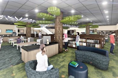Interior view of a modern library with tree-like structures and people interacting.